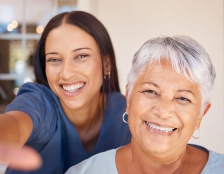Healthcare, doctor and selfie portrait with elderly patient in living room, bonding during checkup at assisted living facility. Trust, senior care and nursing by friendly caretaker relax together.
